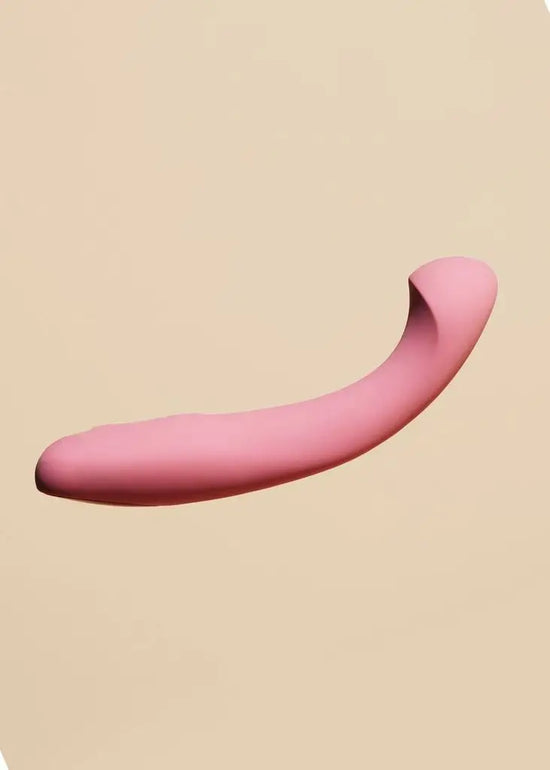 The Arc G-spot vibrator is pictured on a tan background