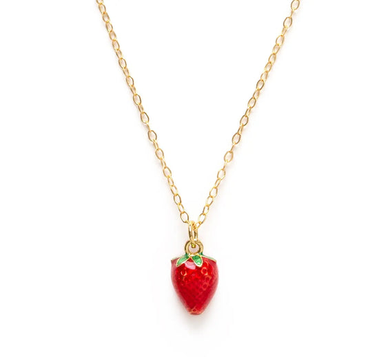 The petite summer strawberry necklace, a tiny red strawberry hanging from a gold chain on a white background