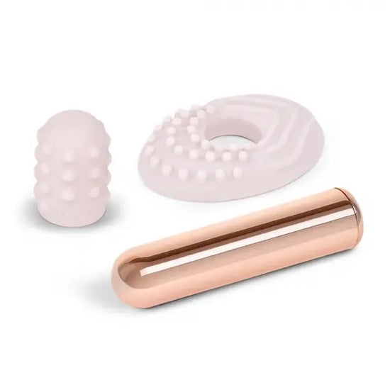 Le wand beginner friendly mini bullet with removable silicone sleeves is pictured with the sleeves sitting next to the vibrator