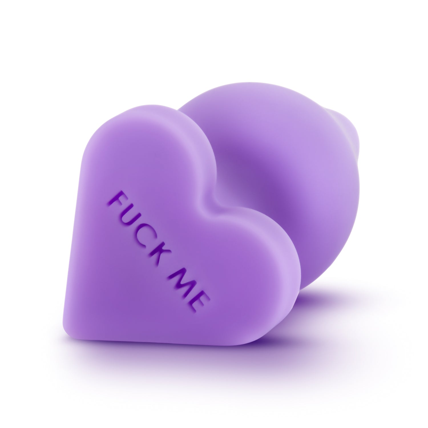 Purple silicone butt plug is shown, in the shape of a candy heart with the words fuck me on it