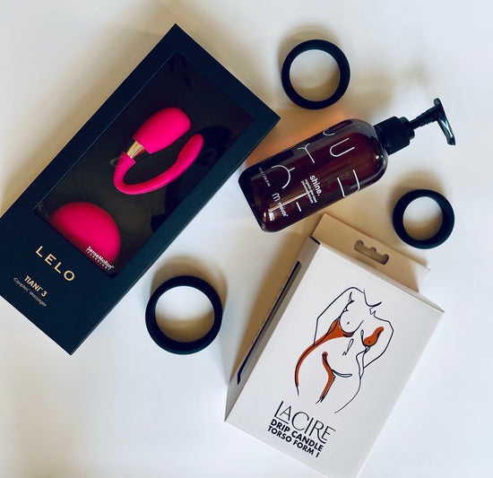 The Vulva and Penis Couples Play Kit, which includes the Tiani 3 couples vibrator by Lelo, Shine Lube by muade, a drip play candle for temperature play by Sportsheets and the 3 ring cock ring set by Wednesday Co. All for good orgasms!